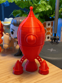 A red 3D printed rocket ship.